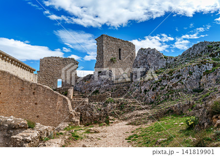 The Cathar medieval castle of Peyrepertuse in the Aude department, southern France situated in the French Pyrenees The Cathar medieval castle of Peyrepertuse in the Aude department, southern France situated in the French Pyrenees 141819901