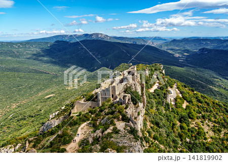 The Cathar medieval castle of Peyrepertuse in the Aude department, southern France situated in the French Pyrenees The Cathar medieval castle of Peyrepertuse in the Aude department, southern France situated in the French Pyrenees 141819902