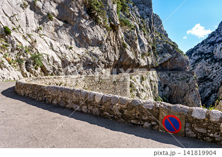 Driving through the amazing Gorges de Galamus, Aude, Eastern Pyrenees, Languedoc Roussillon, France. 141819904