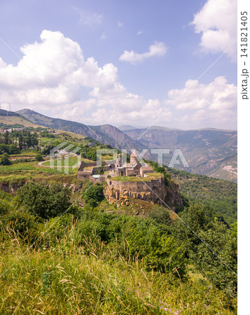 View of historic Armenian Tatev monastery on mountain ridge View of historic Armenian Tatev monastery on mountain ridge 141821405