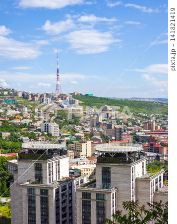Panoramic view of a city nestled on hilly terrain with modern Panoramic view of a city nestled on hilly terrain with modern 141821419