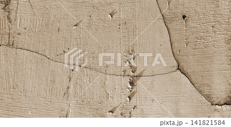 Scratched and cracked sepia plaster surface 141821584