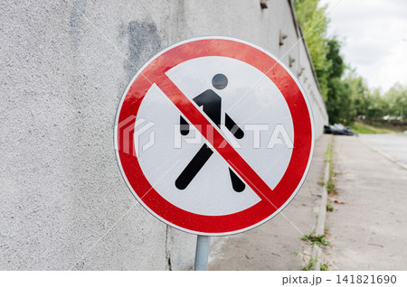 Close-up of no pedestrians regulatory traffic sign. Close-up of no pedestrians regulatory traffic sign. 141821690
