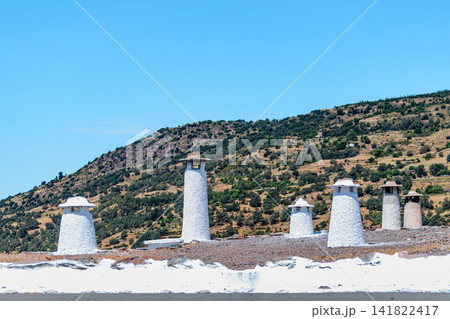 Traditional Moorish chimneys in the Alpajarras village of Bubion, Spain Traditional Moorish chimneys in the Alpajarras village of Bubion, Spain 141822417