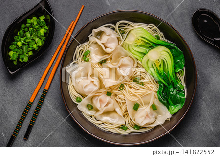 Noodle soup with dumplings (wontons) and cabbage bok choy Noodle soup with dumplings (wontons) and cabbage bok choy 141822552