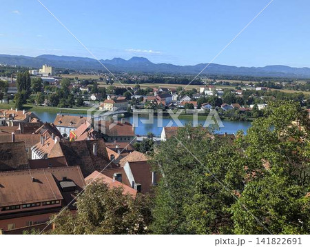 Panoramic view of old town red roofs and Drava river from Ptuj castle Slovenia Panoramic view of old town red roofs and Drava river from Ptuj castle Slovenia 141822691