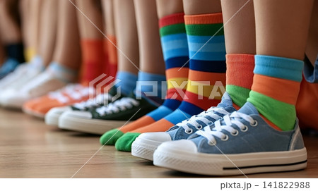 Children standing in a line wearing colorful socks and sneakers Children standing in a line wearing colorful socks and sneakers 141822988