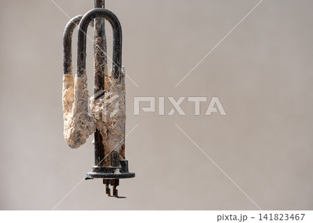 Removed Water Heater Heating Element With Heavy Limescale Buildup Caused By Hard Water. Clean Composition With Copy Space For Appliance Maintenance, Repair And Replacement. 141823467