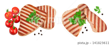 Tuna fish steak grilled isolated on white background with full depth of field, Top view. Flat lay Tuna fish steak grilled isolated on white background with full depth of field, Top view. Flat lay 141823611