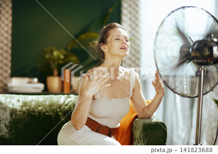 Woman Overheated Seeking Relief from Summer Heat 141823688
