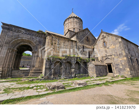 Ruined medieval Tatev monastery under bright blue sky 141823970