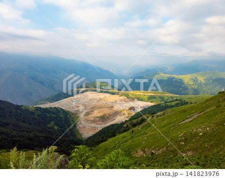 Panoramic view of mountains with a large open pit mine Panoramic view of mountains with a large open pit mine 141823976
