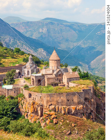 Mountain Tatev monastery in highlands with stone architecture Mountain Tatev monastery in highlands with stone architecture 141824004