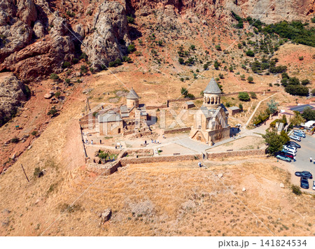 High-angle photograph showing historic Noravank monastery in arid, mountainous region 141824534