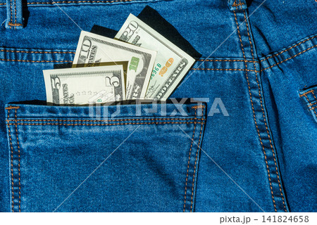 Money in blue jeans pocket Money in blue jeans pocket 141824658
