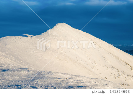Mountain peak in snow Mountain peak in snow 141824698