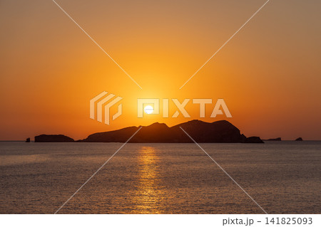 Sa Conillera in a Platges de Comte view with golden reflection and sunset. 141825093