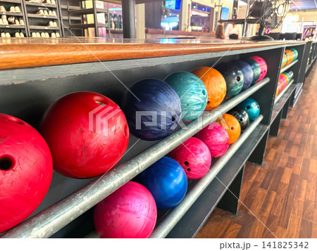 Bowling balls arranged on bowling alley rack Bowling balls arranged on bowling alley rack 141825342
