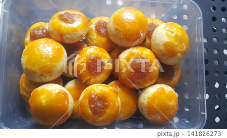 Nastar cake is a round pastry made from a mixture of wheat flour, butter, eggs and sugar, filled with pineapple jam. Nastar cake is a round pastry made from a mixture of wheat flour, butter, eggs and sugar, filled with pineapple jam. 141826273