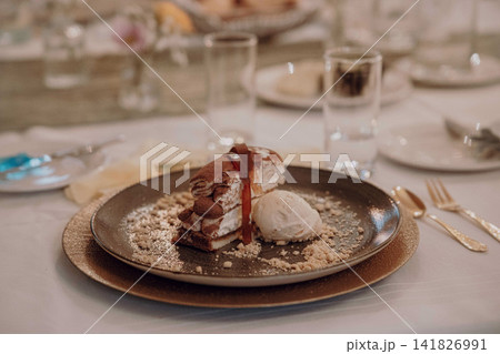 Gourmet dining experience with exquisite dish presentation. Fine wedding dining and culinary art. Gourmet dining experience with exquisite dish presentation. Fine wedding dining and culinary art. 141826991