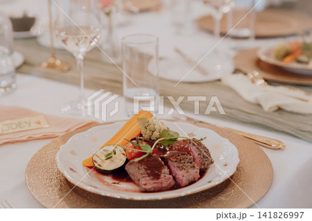 Gourmet dining experience with exquisite dish presentation. Fine wedding dining and culinary art. Gourmet dining experience with exquisite dish presentation. Fine wedding dining and culinary art. 141826997
