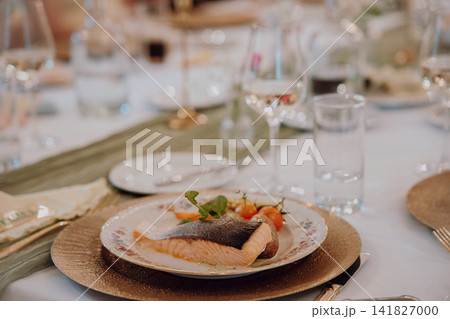 Gourmet dining experience with exquisite dish presentation. Fine wedding dining and culinary art. Gourmet dining experience with exquisite dish presentation. Fine wedding dining and culinary art. 141827000