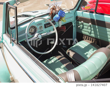 Retro interior and steering wheel of a green vintage VW Beetle at a show in Ruston - June 13, 2026 Ruston WA, USA Retro interior and steering wheel of a green vintage VW Beetle at a show in Ruston - June 13, 2026 Ruston WA, USA 141827407