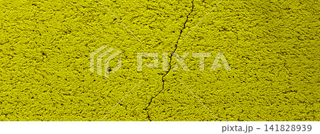 A cracked, bright yellow textured wall A cracked, bright yellow textured wall 141828939