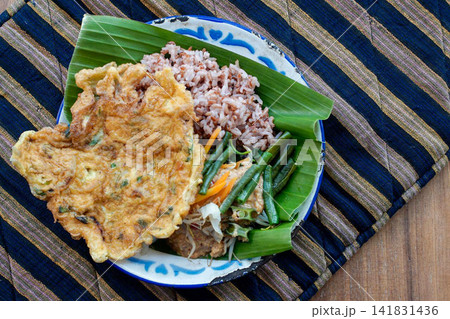 Traditional Indonesian Pecel with Red Rice and Omelet Traditional Indonesian Pecel with Red Rice and Omelet 141831436