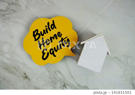 Build Home Equity text written on speed bubble and house model 141831501