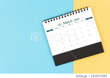 March 2027 desk calendar on blue and yellow, planning for business meeting or planning concept. 141831995