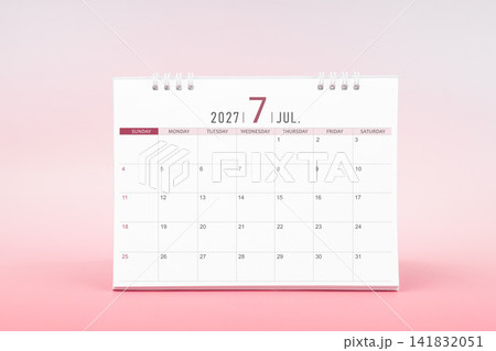 July blank desk calendar for 2027 year on pink color background. July blank desk calendar for 2027 year on pink color background. 141832051