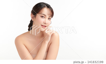 A beautiful young Asian woman with clean, fresh skin against a white background. Skincare, facial treatment, cosmetology, beauty, and spa. An elegant portrait of an Asian woman. A beautiful young Asian woman with clean, fresh skin against a white background. Skincare, facial treatment, cosmetology, beauty, and spa. An elegant portrait of an Asian woman. 141832199