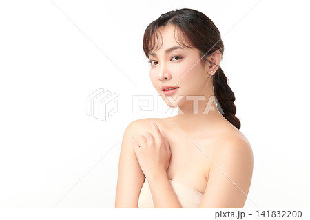 A beautiful young Asian woman with clean, fresh skin against a white background. Skincare, facial treatment, cosmetology, beauty, and spa. An elegant portrait of an Asian woman. A beautiful young Asian woman with clean, fresh skin against a white background. Skincare, facial treatment, cosmetology, beauty, and spa. An elegant portrait of an Asian woman. 141832200