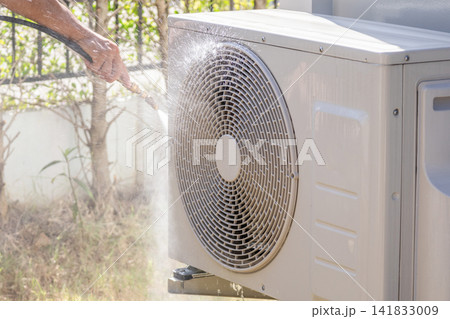 air conditioning compressor outdoor unit cleaning service with water spray 141833009