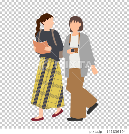 Two young women walking through the autumn streets. Two young women walking through the autumn streets. 141836194