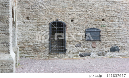 Ancient Masonry Wall Secured by Heavy Iron Gate and Padlocked Hatch Ancient Masonry Wall Secured by Heavy Iron Gate and Padlocked Hatch 141837657