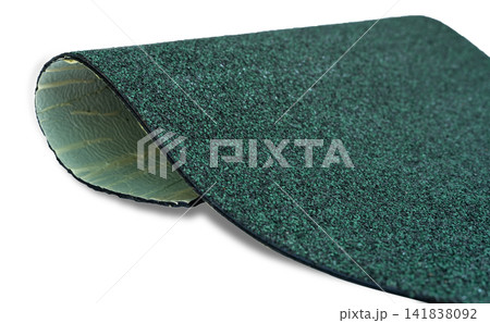 Selective focus on hunter green color shingle roof on white background. Roofing material. Shingle roof texture. Shingle roof made from asphalt, plastic fiberglass. Rough dark green granules surface. Selective focus on hunter green color shingle roof on white background. Roofing material. Shingle roof texture. Shingle roof made from asphalt, plastic fiberglass. Rough dark green granules surface. 141838092