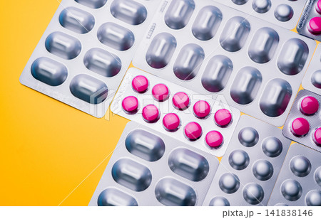 Blister packs containing assorted pharmaceutical tablets for prescription medicine, healthcare services, drug manufacturing, pharmacy distribution, medical treatment, and pharmaceutical industry. 141838146