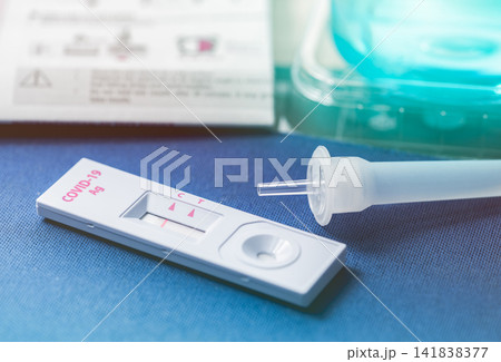 Covid 19 antigen self test for nasal swab with positive result. Antigen test kit for home use to detection coronavirus infection. Negative test result from rapid antigen test. Coronavirus diagnosis. 141838377