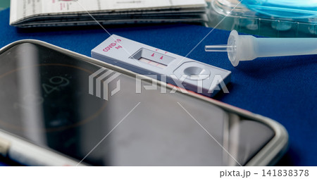 Covid 19 antigen self-test for nasal swab with positive result. Antigen test kit for home use to detection coronavirus infection. Positive test result from rapid antigen test. Coronavirus diagnosis. Covid 19 antigen self-test for nasal swab with positive result. Antigen test kit for home use to detection coronavirus infection. Positive test result from rapid antigen test. Coronavirus diagnosis. 141838378