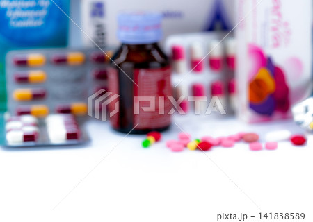 Blurred of tablets pills, drug bottle, and capsule in pack of pills. Drug packaging. Pharmacy shop products. Pharmaceuticals and healthcare concept. Pharmaceutical industry. Vitamins and supplements. Blurred of tablets pills, drug bottle, and capsule in pack of pills. Drug packaging. Pharmacy shop products. Pharmaceuticals and healthcare concept. Pharmaceutical industry. Vitamins and supplements. 141838589
