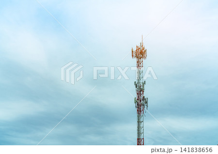 Telecommunication tower with blue sky and white clouds. Antenna on blue sky. Radio and satellite pole. Communication technology. Telecommunication industry. Mobile or telecom 4g network. Technology Telecommunication tower with blue sky and white clouds. Antenna on blue sky. Radio and satellite pole. Communication technology. Telecommunication industry. Mobile or telecom 4g network. Technology 141838656