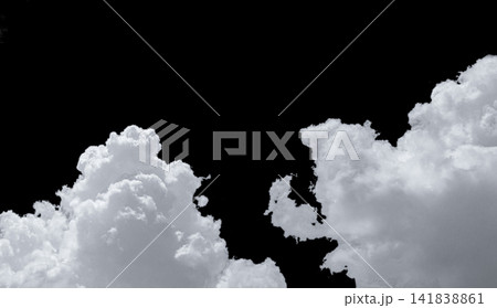 Pure white cumulus clouds on black background. Cloudscape background. White fluffy clouds on dark background. Soft cotton feel of white clouds texture isolated on black background with copy space Pure white cumulus clouds on black background. Cloudscape background. White fluffy clouds on dark background. Soft cotton feel of white clouds texture isolated on black background with copy space 141838861