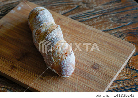 Artisan Bread Loaf on Rustic Wooden Board Artisan Bread Loaf on Rustic Wooden Board 141839243
