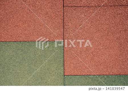 Aesthetic diagonal background of textured outdoor red rubber mat pavement, perfect for architectural Aesthetic diagonal background of textured outdoor red rubber mat pavement, perfect for architectural 141839547