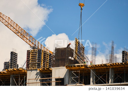 High Rise Residential Building Under Construction with Tower Crane High Rise Residential Building Under Construction with Tower Crane 141839634