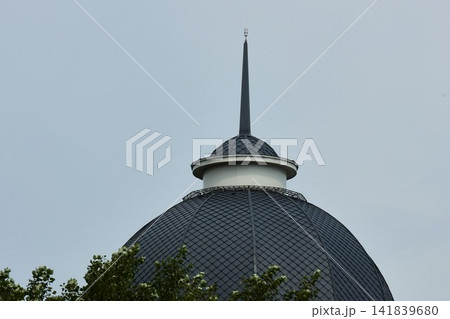 Minimalist Dark Geometric Building Spire and Tiled Dome Minimalist Dark Geometric Building Spire and Tiled Dome 141839680