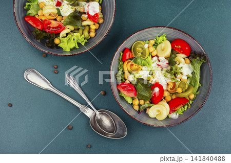 Healthy vegetarian pasta salad with chickpeas and tomatoes Healthy vegetarian pasta salad with chickpeas and tomatoes 141840488