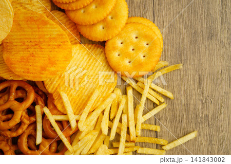Mix of variety snack chips pretzel and cracker, junk crunchy food. Mix of variety snack chips pretzel and cracker, junk crunchy food. 141843002
